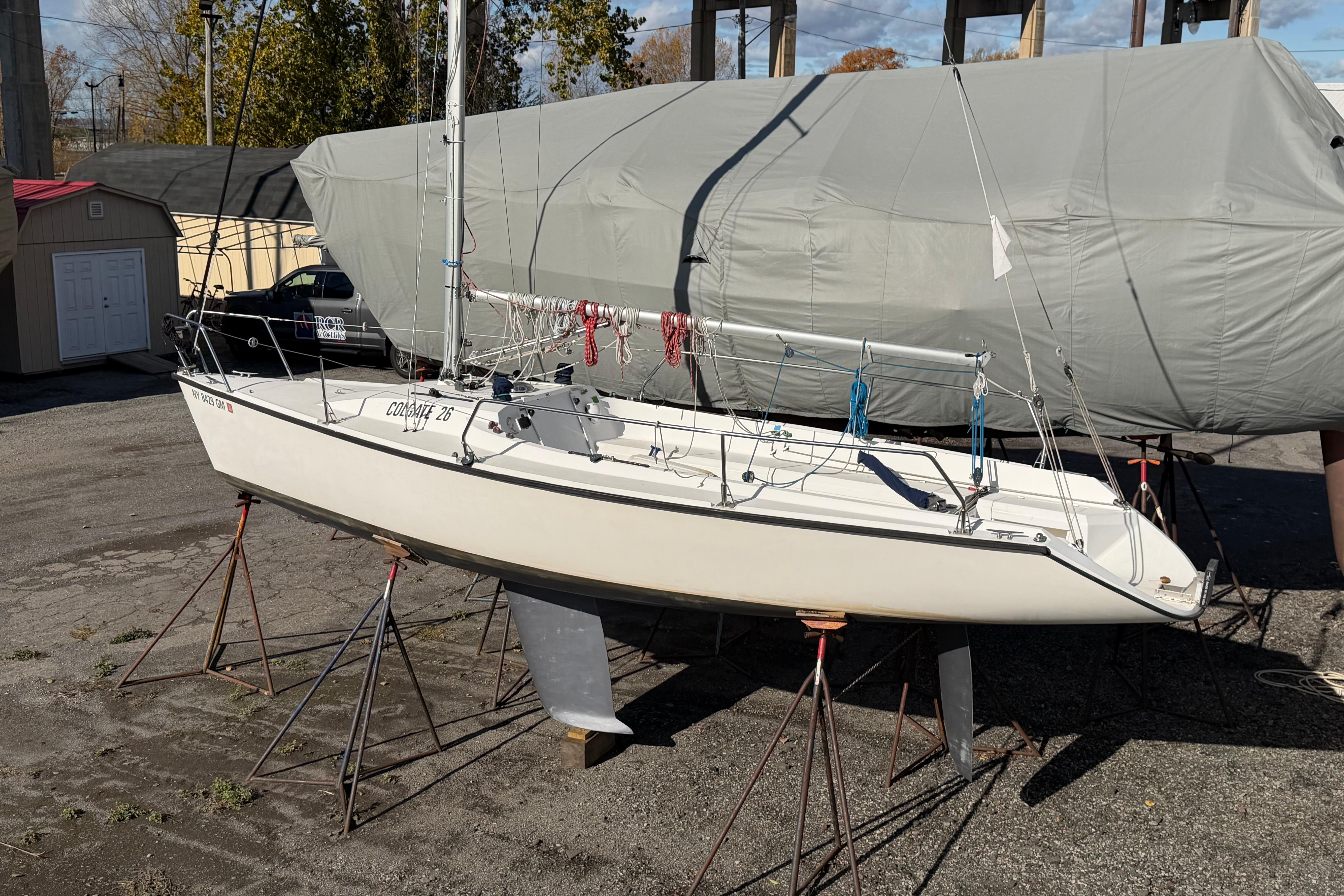 Sailboat Colgate 26, 2004 model, on stands in a boatyard.