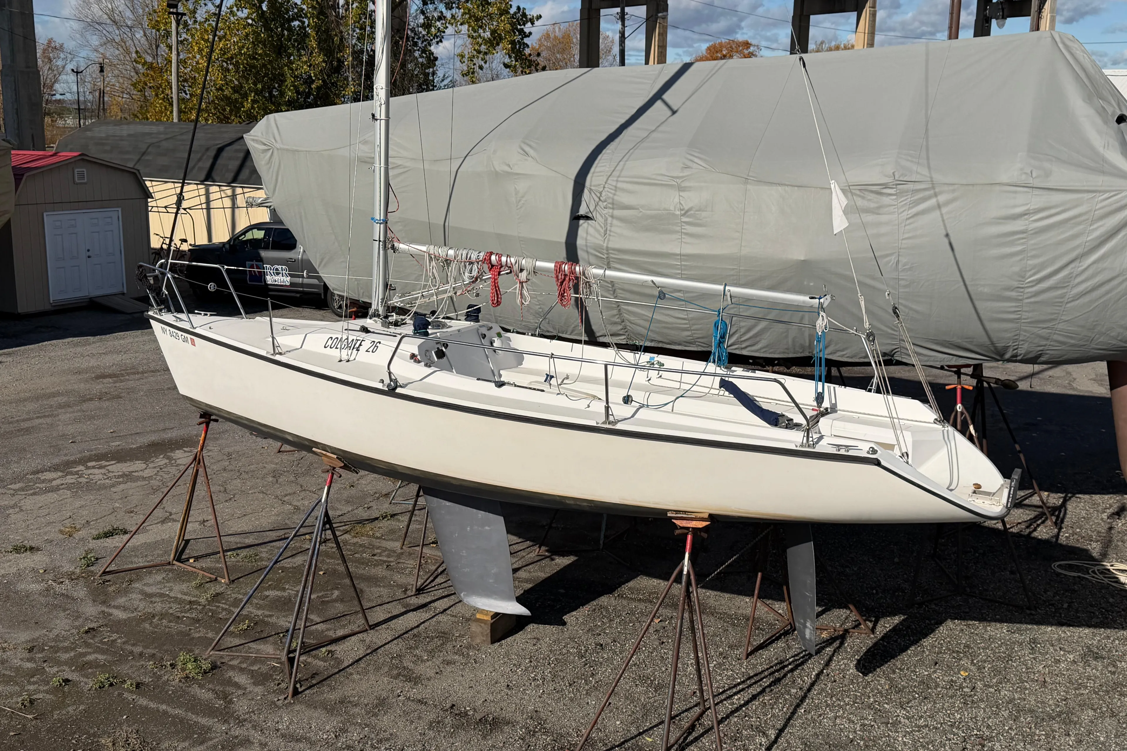 Sailboat Colgate 26, 2004 model, on stands in a boatyard.