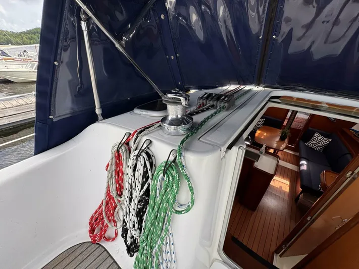  Yacht Photos Pics 2006 Beneteau 373 sailboat cockpit with ropes and view into cabin interior.