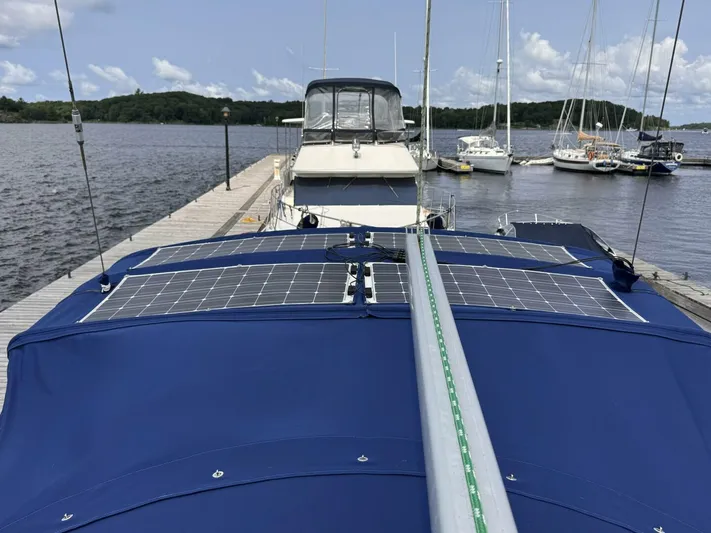  Yacht Photos Pics Sailboat with solar panels docked at marina, Beneteau 373, 2006 model.