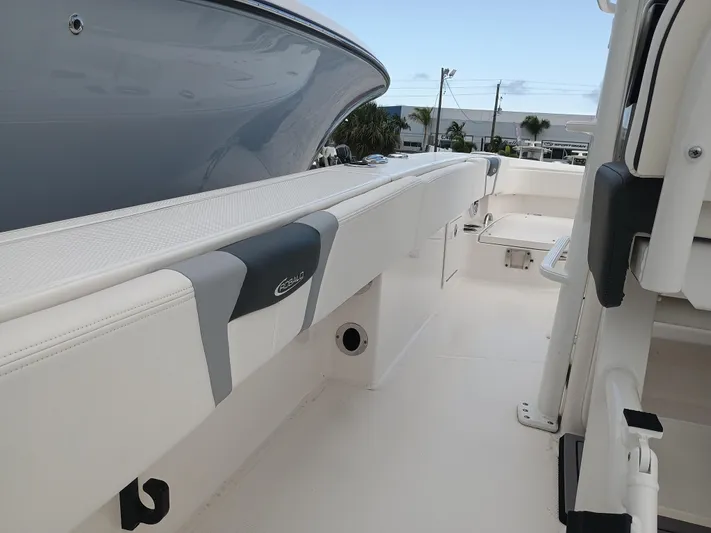 266-105 Yacht Photos Pics 2023 Robalo 266 Cayman SD boat interior, featuring sleek seating and modern design.
