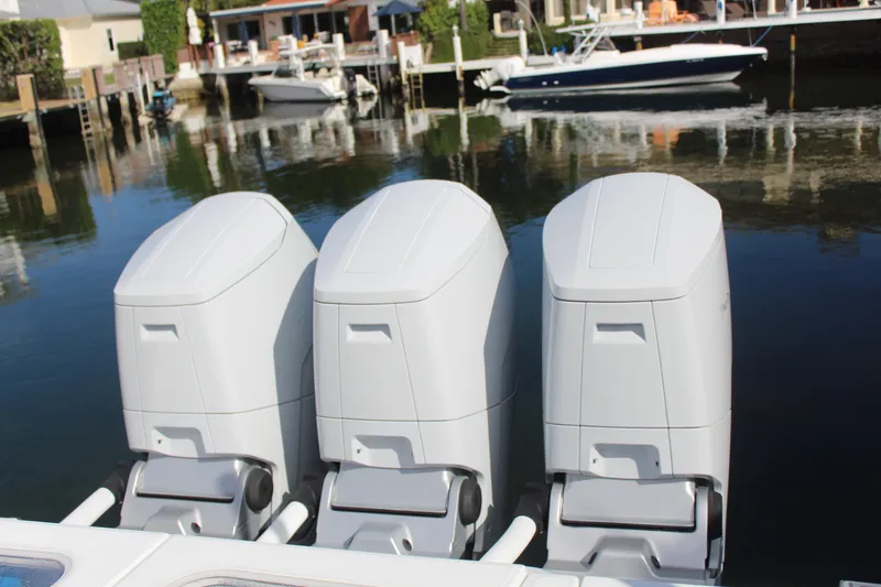  Yacht Photos Pics Three outboard engines of HCB 42 Lujo 2023 by the water.