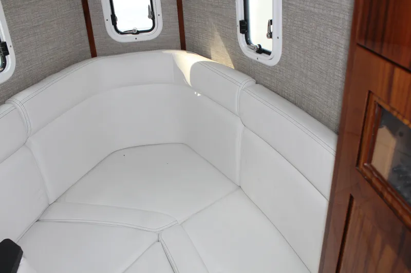  Yacht Photos Pics Interior of 2023 HCB 42 Lujo with white upholstered seating.
