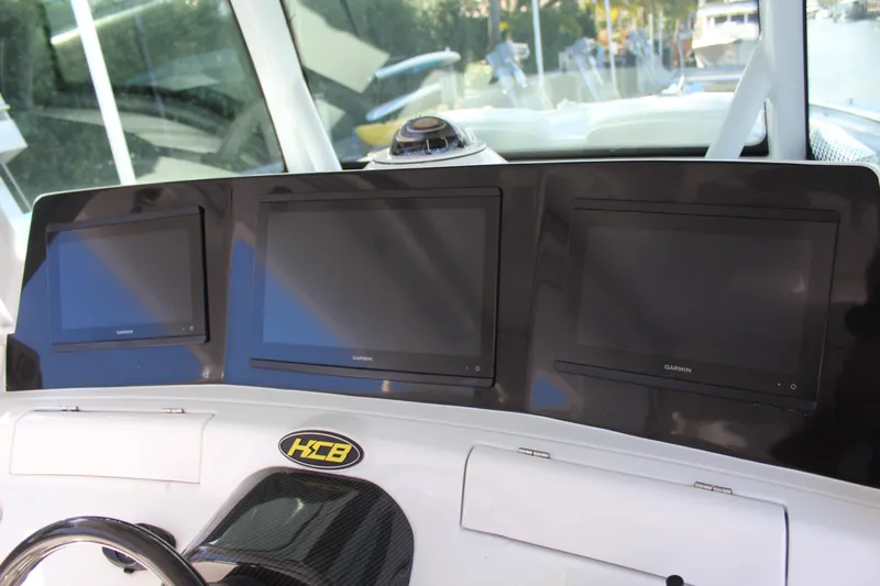  Yacht Photos Pics Dashboard of HCB 42 Lujo 2023 with three screens.