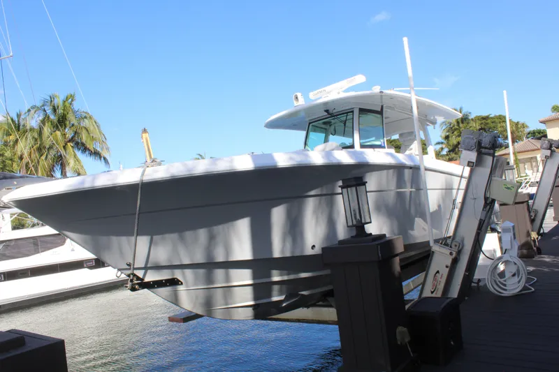  Yacht Photos Pics 2023 HCB 42 Lujo boat docked by waterfront.