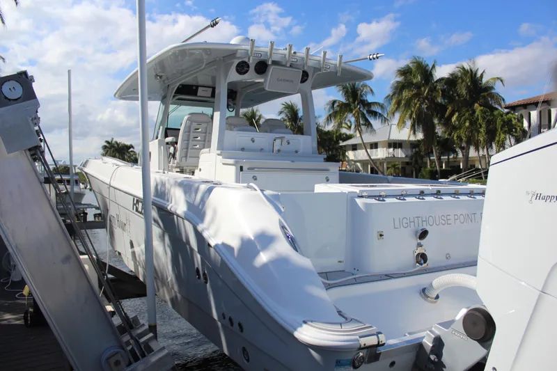  Yacht Photos Pics 2023 HCB 42 Lujo boat docked with palm trees in background.