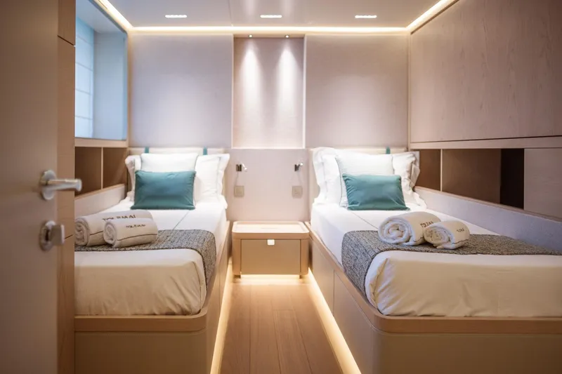 Tolemai Yacht Photos Pics Luxurious twin cabin interior on 2023 Sanlorenzo XSP202 yacht, featuring modern design and ambient lighting.