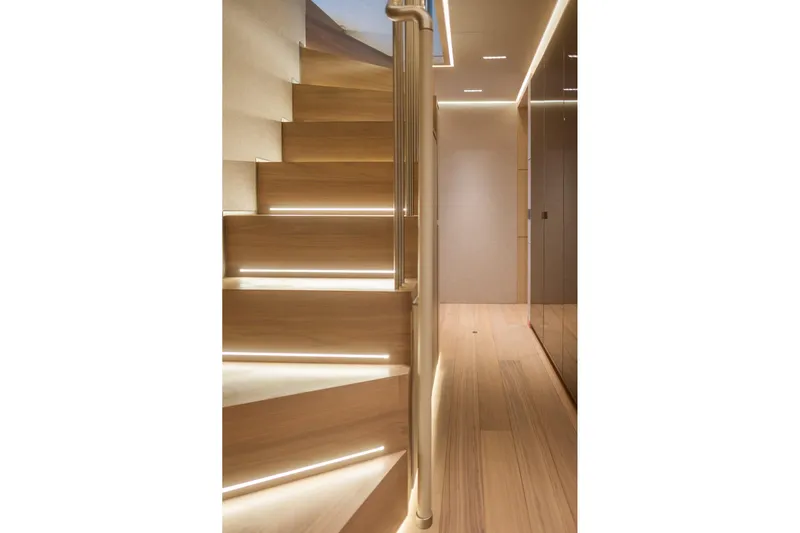 Tolemai Yacht Photos Pics Modern wooden staircase with ambient lighting on Sanlorenzo XSP202 yacht, 2023 model.