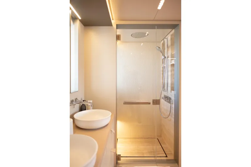 Tolemai Yacht Photos Pics Modern bathroom with glass shower in 2023 Sanlorenzo XSP202 yacht.