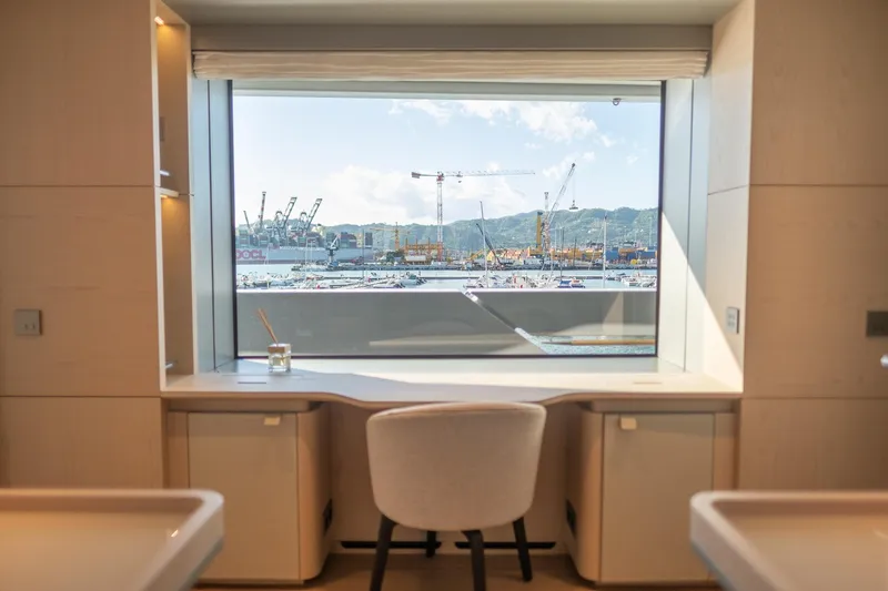 Tolemai Yacht Photos Pics Luxurious Sanlorenzo XSP202 yacht interior with harbor view through large window, 2023 model.