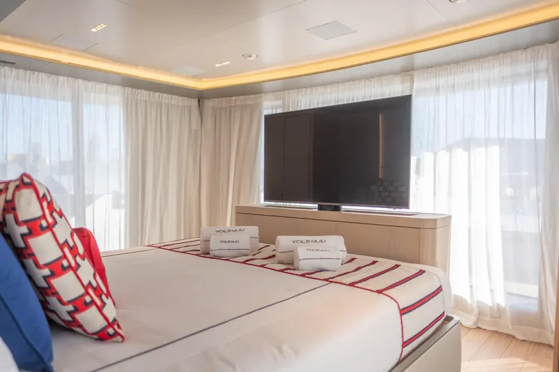 Tolemai Yacht Photos Pics Luxurious Sanlorenzo XSP202 yacht bedroom with modern decor and large TV, 2023 model.