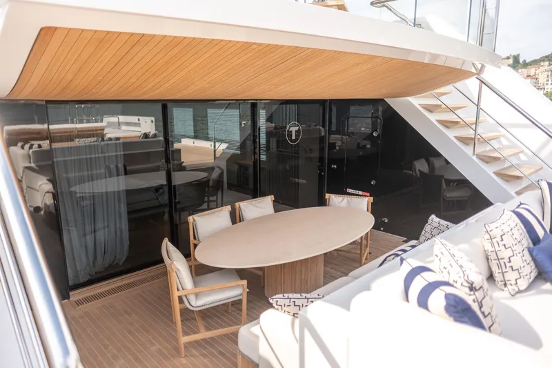 Tolemai Yacht Photos Pics Luxurious 2023 Sanlorenzo XSP202 yacht deck with elegant seating and dining area.