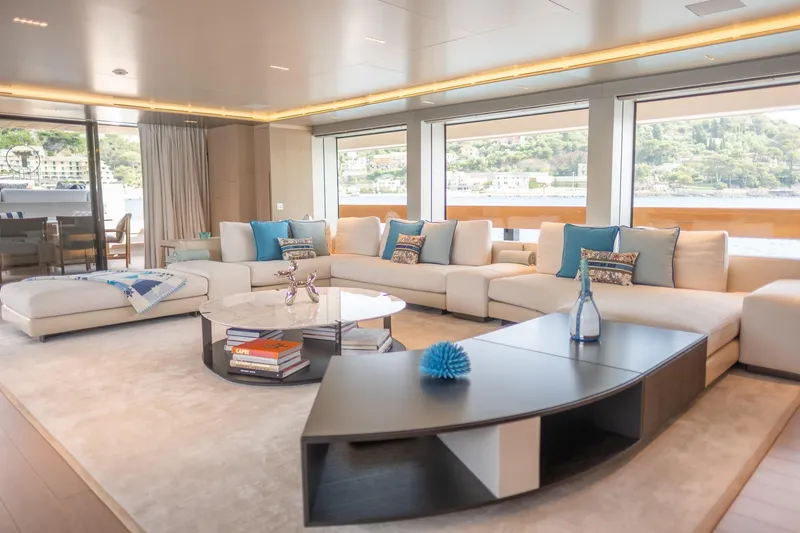 Tolemai Yacht Photos Pics Luxurious interior of 2023 Sanlorenzo XSP202 yacht with elegant seating and panoramic windows.