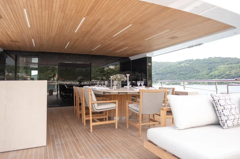 Tolemai Yacht Photos Pics Luxurious Sanlorenzo XSP202 yacht deck with elegant dining area, 2023 model.