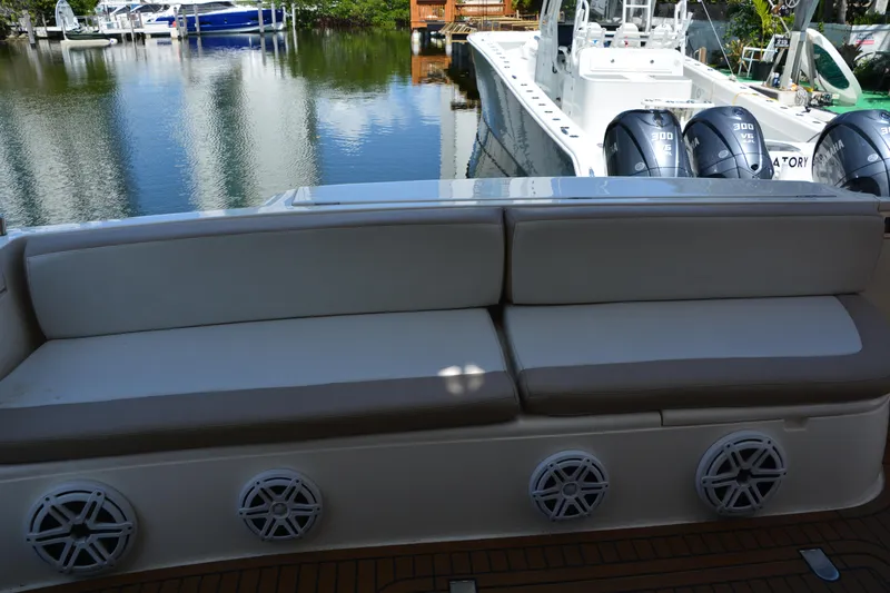 B&t Escape Yacht Photos Pics Luxury seating on a 2005 Princess 61 yacht, docked near water.