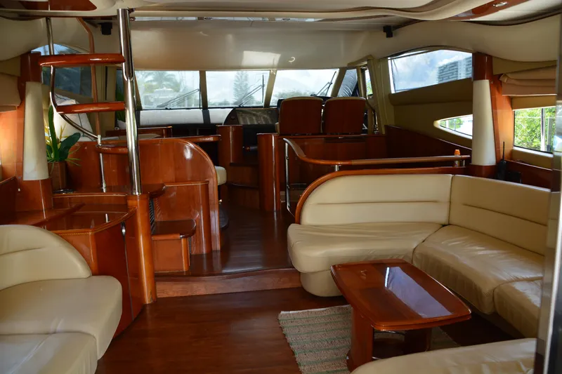 B&t Escape Yacht Photos Pics Luxurious interior of a 2005 Princess 61 yacht with elegant wood and leather furnishings.