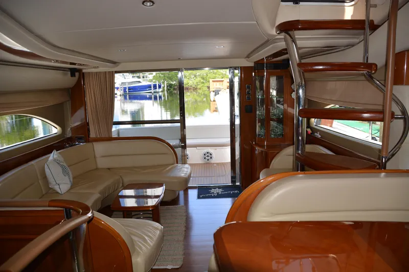 B&t Escape Yacht Photos Pics Luxurious interior of a 2005 Princess 61 yacht with elegant seating and wooden accents.