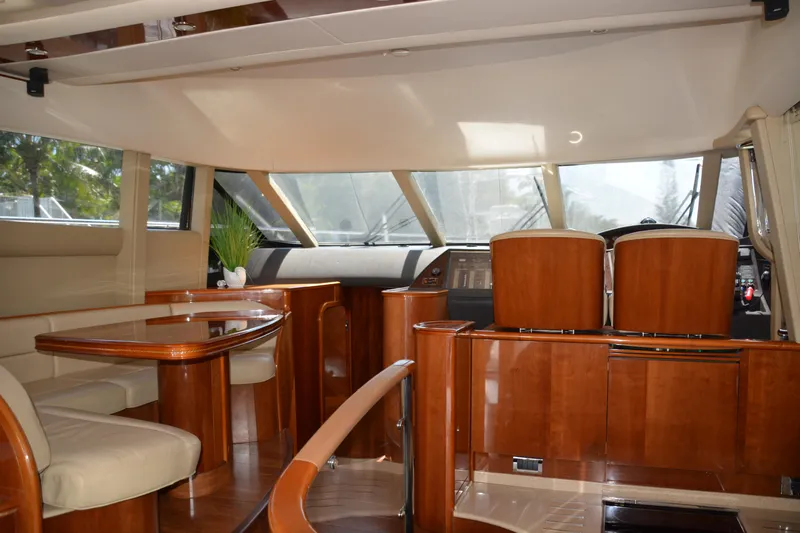 B&t Escape Yacht Photos Pics Luxurious interior of a 2005 Princess 61 yacht with elegant wood finishes.