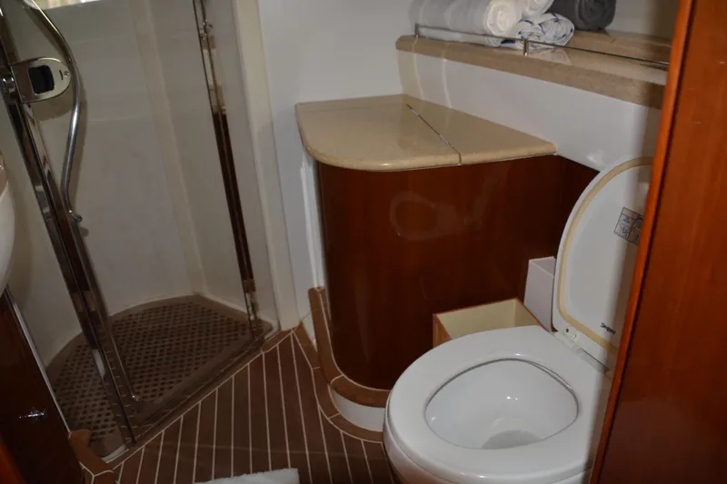 B&t Escape Yacht Photos Pics Luxurious bathroom on a 2005 Princess 61 yacht with shower and toilet.