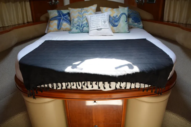 B&t Escape Yacht Photos Pics Luxurious cabin interior of 2005 Princess 61 yacht with elegant bedding and decorative pillows.