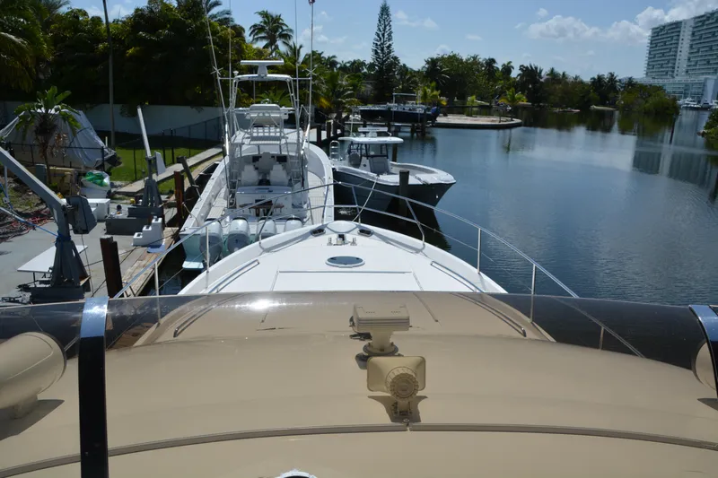 B&t Escape Yacht Photos Pics Luxury yacht docked in a serene marina, Princess 61 model, 2005.