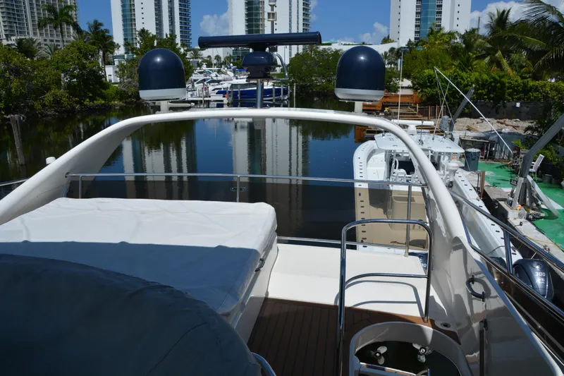 B&t Escape Yacht Photos Pics 2005 Princess 61 yacht deck with cityscape and waterway view.