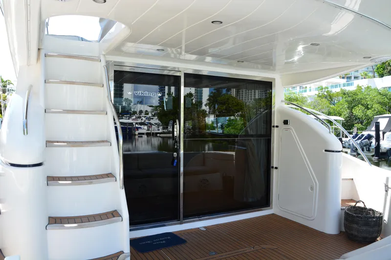 B&t Escape Yacht Photos Pics Luxury yacht Princess 61, 2005 model, featuring sleek design and spacious deck area.