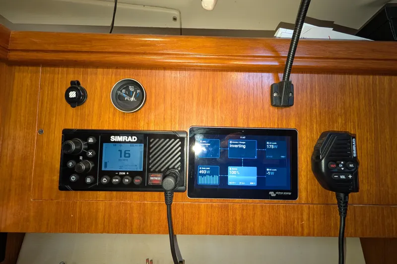 'mystic Cay' Yacht Photos Pics Control panel of a 2002 Hunter 450 Passage yacht with Simrad and Victron Energy displays.
