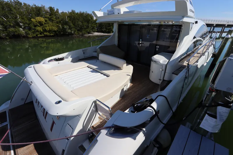  Yacht Photos Pics Luxury 2007 Azimut 62S yacht docked, featuring spacious deck and sleek design.