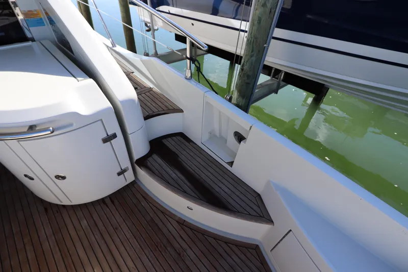  Yacht Photos Pics 2007 Azimut 62S yacht with elegant wooden steps and sleek white cabinetry.