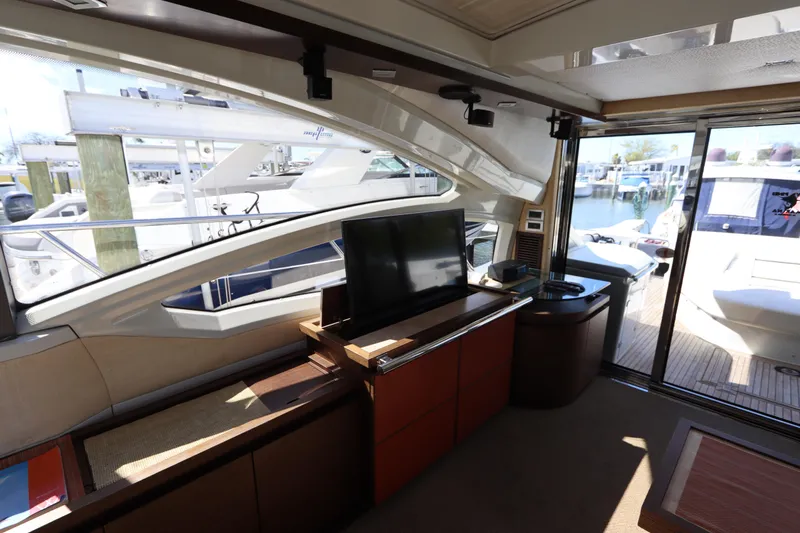  Yacht Photos Pics Interior of 2007 Azimut 62S yacht with modern furnishings and marina view.