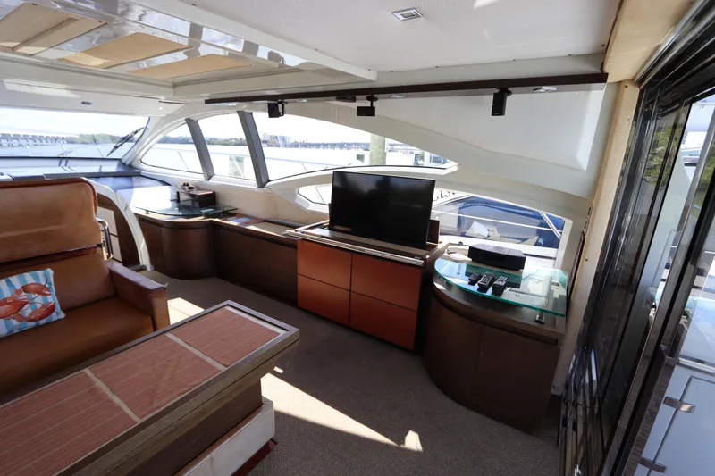  Yacht Photos Pics Luxurious interior of a 2007 Azimut 62S yacht with modern furnishings and panoramic windows.