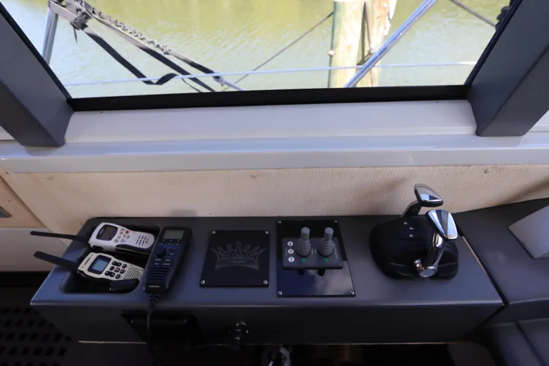  Yacht Photos Pics Control panel of a 2007 Azimut 62S yacht with communication devices and throttle controls.