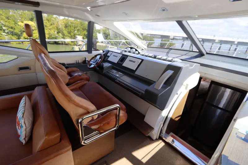  Yacht Photos Pics Luxurious interior of 2007 Azimut 62S yacht with leather seating and modern helm.