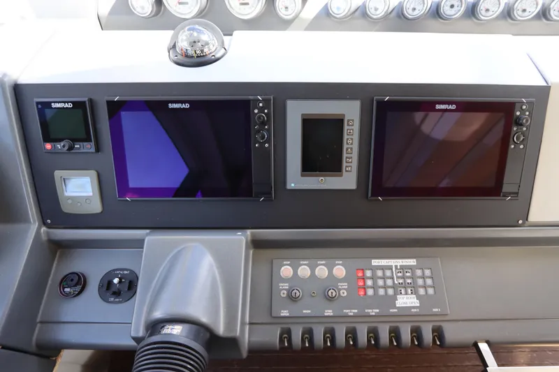  Yacht Photos Pics Control panel of a 2007 Azimut 62S yacht with Simrad navigation displays.