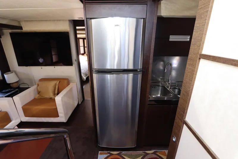  Yacht Photos Pics Interior of 2007 Azimut 62S yacht featuring modern kitchen and cozy seating area.