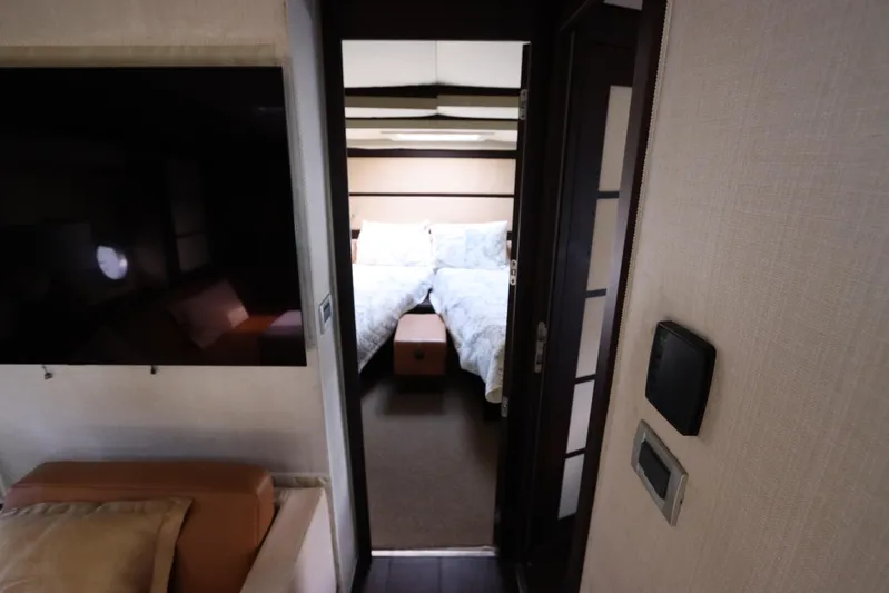  Yacht Photos Pics Interior of 2007 Azimut 62S yacht showing a cozy bedroom and modern design.