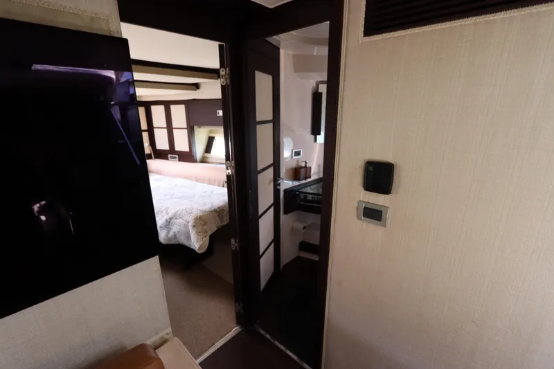  Yacht Photos Pics Interior of 2007 Azimut 62S yacht showing bedroom and bathroom entrance.