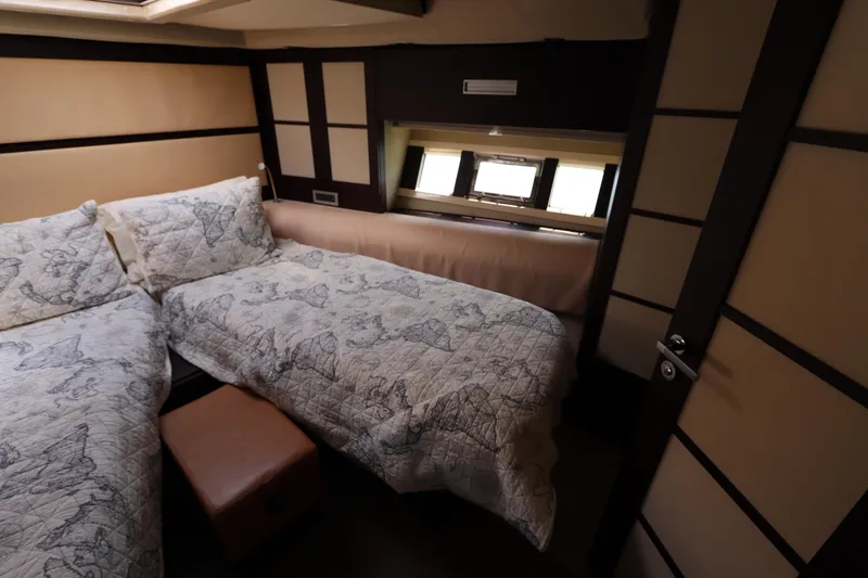  Yacht Photos Pics Luxurious cabin interior of 2007 Azimut 62S yacht with twin beds and elegant decor.