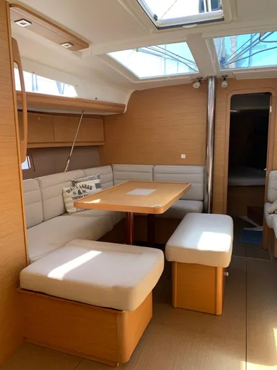  Yacht Photos Pics Interior of 2016 Dufour 410 Grand Large yacht with cozy seating and natural light.
