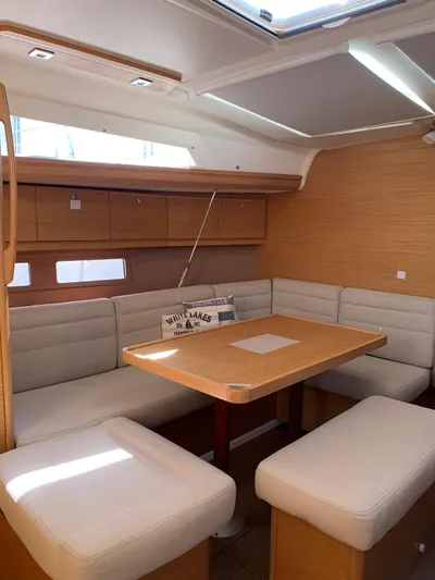  Yacht Photos Pics Interior of 2016 Dufour 410 Grand Large yacht with modern seating and dining area.
