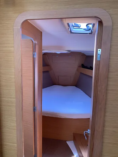  Yacht Photos Pics 2016 Dufour 410 Grand Large cabin interior with wooden finish and skylight.