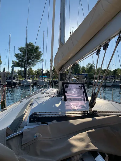  Yacht Photos Pics 2016 Dufour 410 Grand Large sailboat docked in a sunny marina.