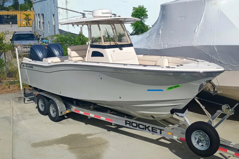 271-508 Brokerage Joe Yacht Photos Pics 2023 Grady-White Canyon 271 boat on trailer, parked outdoors, for sale.