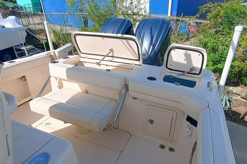 271-508 Brokerage Joe Yacht Photos Pics 2023 Grady-White Canyon 271 boat interior with seating and storage compartments.