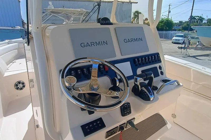 271-508 Brokerage Joe Yacht Photos Pics 2023 Grady-White Canyon 271 boat dashboard with Garmin navigation systems.