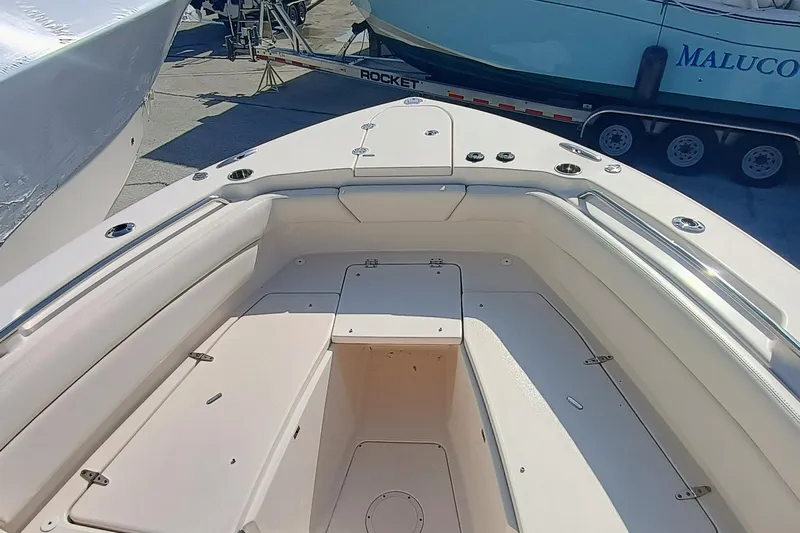 271-508 Brokerage Joe Yacht Photos Pics 2023 Grady-White Canyon 271 boat interior with seating and storage compartments.