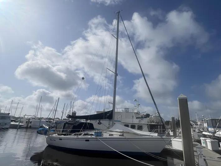 Bella Vita Yacht Photos Pics Sailboat Catalina 42 MkII 1999 docked at marina under cloudy sky.