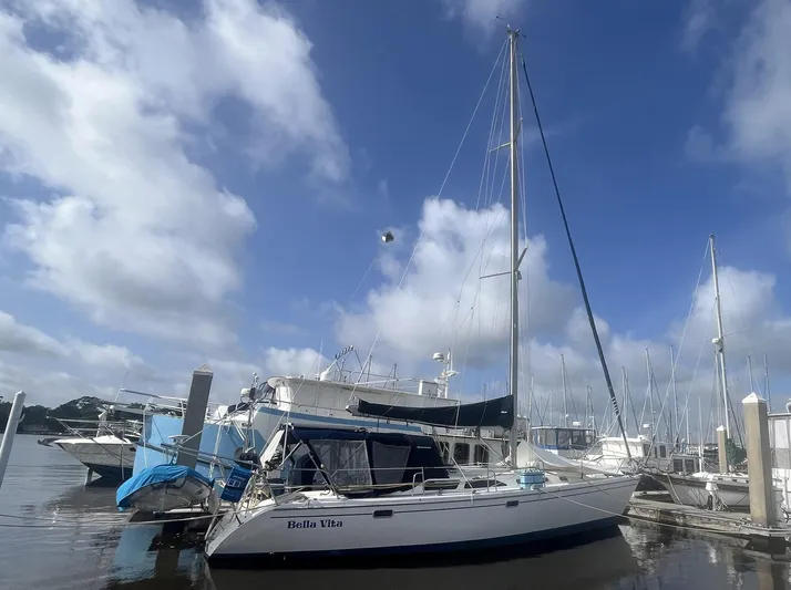 Bella Vita Yacht Photos Pics 1999 Catalina 42 MkII sailboat docked under a clear blue sky.