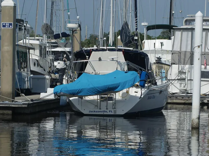Bella Vita Yacht Photos Pics Catalina 42 MkII sailboat docked in Jacksonville marina, covered with a blue tarp.